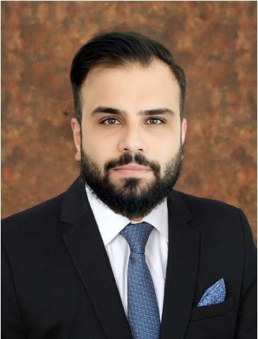 Ahsan Tahir - Headshot with a brown background